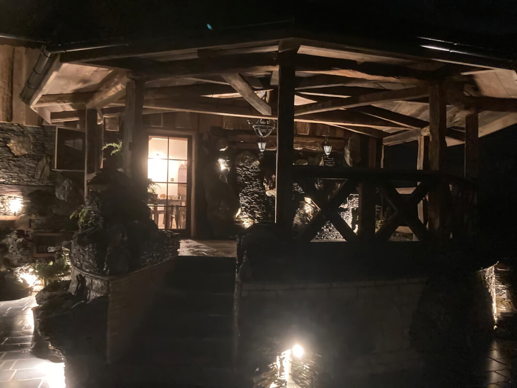 Covered wooden terrace Harmeze, pavilion by the pond, night lighting