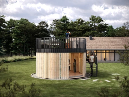 Two-level Garden's Heart gazebo in a green garden, a person on the upper terrace taking photos, entrance to the lower part, a house in the background.