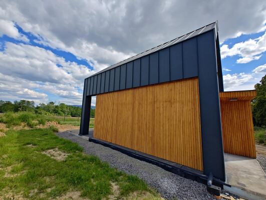 Details of larch duo rhomb facade. Modern board, black frame detail.