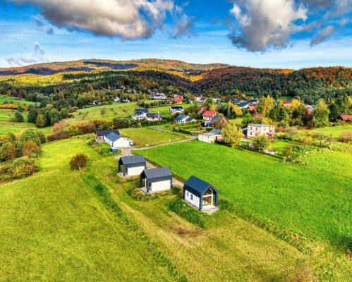 Drone view of the Ekodom 50 timber-frame housing estate in Bierna; realization of 3 buildings.